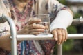 Senior woman broken wrist using walker Royalty Free Stock Photo