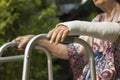 Senior woman broken wrist using walker. Royalty Free Stock Photo