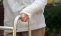 Senior woman broken wrist using walker in backyard Royalty Free Stock Photo