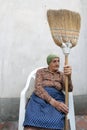 Senior woman broom