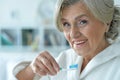 Senior woman brushing her teeth Royalty Free Stock Photo