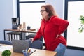 Senior woman business worker suffering for backache at office Royalty Free Stock Photo