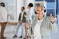 Senior woman, call center and smile with thumbs up for good job, thank you or agree at office. Portrait of elderly Royalty Free Stock Photo