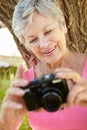 Senior woman with camera Royalty Free Stock Photo