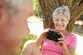 Senior woman with camera Royalty Free Stock Photo