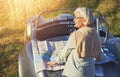 Senior woman, car and lost outdoor with map for travel, retirement and sign on vacation. Elderly person, cobra and Royalty Free Stock Photo