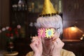 Senior woman celebrating 70th anniversary with joy Royalty Free Stock Photo