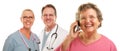 Senior Woman on Cell Phone and Doctors Behind Royalty Free Stock Photo