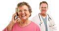 Senior Woman on Cell Phone with Male Doctor Behind Royalty Free Stock Photo