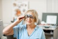 Senior woman checking vision Royalty Free Stock Photo