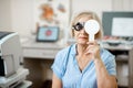 Senior woman checking vision Royalty Free Stock Photo