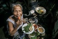 Senior woman chef cooks in the kitchen