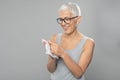 Senior woman cleaning hands with wet wipes - prevention of infectious diseases