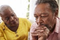 Senior Woman Comforting Man With Depression At Home Royalty Free Stock Photo