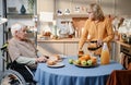 Senior woman cooking breakfast for her husband Royalty Free Stock Photo