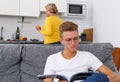 Woman cooking breakfast to her adult son Royalty Free Stock Photo