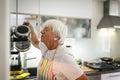 Senior woman cooking in the kitchen Royalty Free Stock Photo