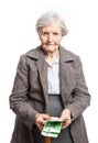 Senior woman counting money on white background