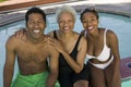 Senior woman with couple at swimming pool Royalty Free Stock Photo