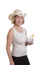 Senior woman with cowboyhat and drink Royalty Free Stock Photo