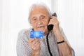 Senior Woman With Credit Card On Phone Royalty Free Stock Photo