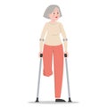 Senior woman on crutches isolated. Injured lady