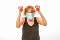 Senior Woman Defiant About Exercising While Wearing Face Mask During Corona Virus Epidemic