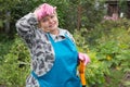 Senior woman digging on field