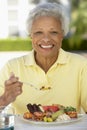 Senior Woman Dining Al Fresco