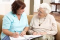 Senior Woman In Discussion With Health Visitor