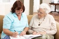 Senior Woman In Discussion With Health Visitor Royalty Free Stock Photo