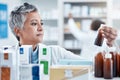 Senior woman, doctor and medicine for healthcare prescription checking stock on shelf in pharmacy. Elderly female Royalty Free Stock Photo