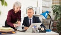 Man and woman clerical workers in office