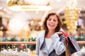 Senior woman doing Christmas shopping. Royalty Free Stock Photo