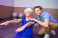 senior woman doing sport exercises with coach or personal trainer Royalty Free Stock Photo