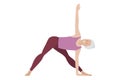 Senior woman doing yoga. Woman in sportswear makes Triangle Pose. Elderly Lady happy and enjoys old age. Women healthy