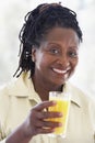 Senior Woman Drinking Fresh Orange Juice Royalty Free Stock Photo