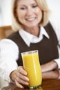 Senior Woman Drinking A Glass Of Orange Juice Royalty Free Stock Photo