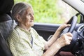 Senior woman driving a car. Royalty Free Stock Photo