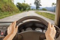 Senior woman driving car on mountain road. Royalty Free Stock Photo