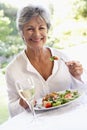 Senior Woman Eating An Al Fresco Lunch Royalty Free Stock Photo