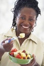 Senior Woman Eating Fresh Fruit Salad Royalty Free Stock Photo