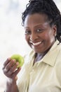 Senior Woman Eating Green Apple