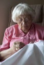 Senior woman embroidering