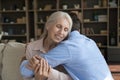 Senior woman enjoy tender moments, sweet cuddles of grownup son Royalty Free Stock Photo