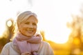 Senior woman enjoying autumn colors