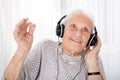 Senior Woman Enjoying Music With Headphone Royalty Free Stock Photo