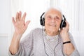 Senior Woman Enjoying Music With Headphone Royalty Free Stock Photo