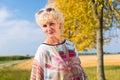 Senior woman enjoying the retirement outdoors in a sunny day in Royalty Free Stock Photo