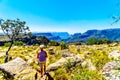 Senior woman enjoying the view of the highveld and the Blyde River Dam in the Blyde River Canyon